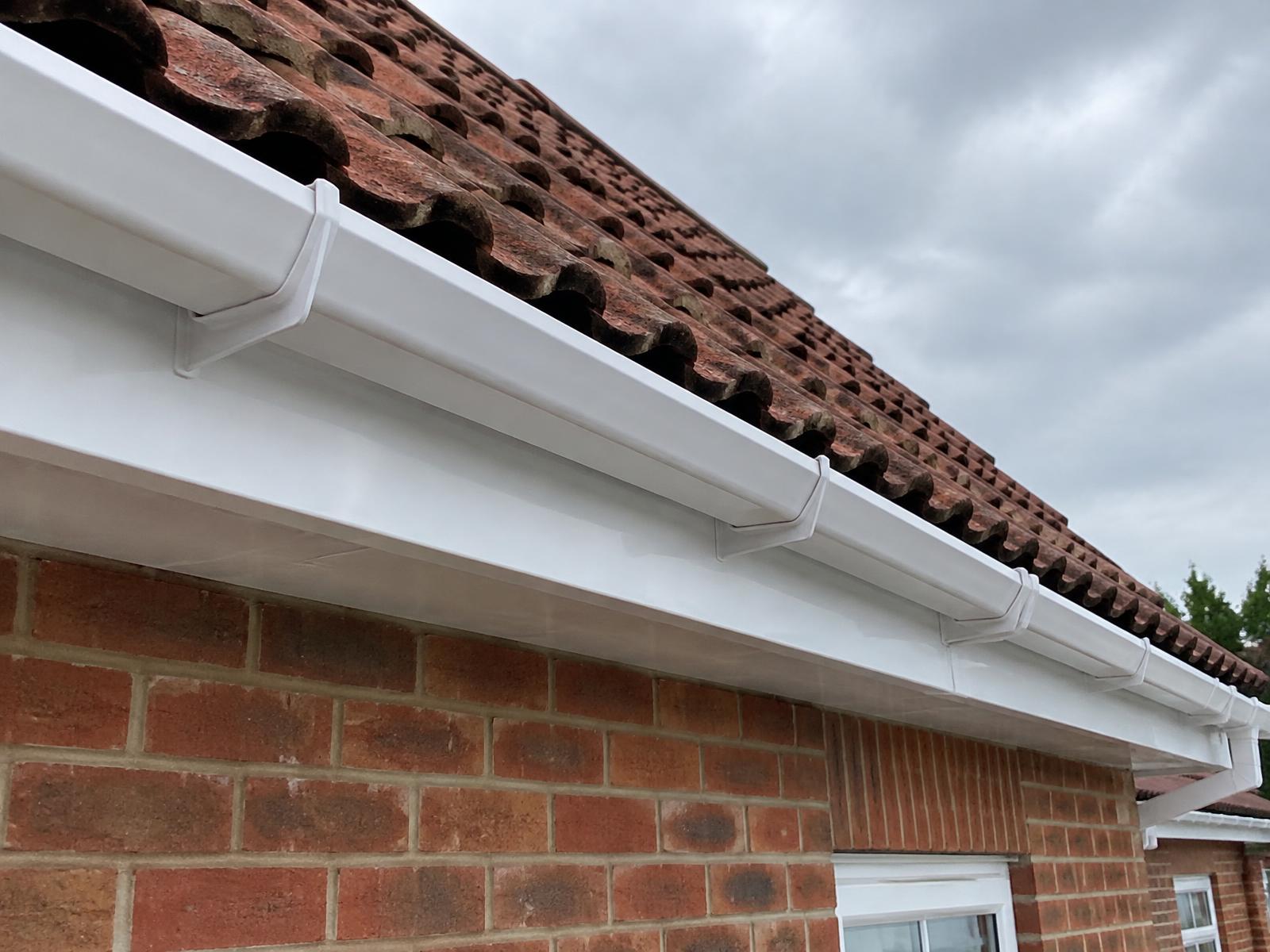 Clean white uPVC fascia boards and gutter on a house in Dorset